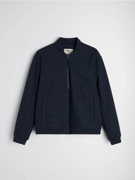 Kurtka softshell bomber - granatowy. Niebieskie kurtki męskie Sinsay, l, bez wzorów, z softshellu, bez kaptura. Za 99.99 zł.