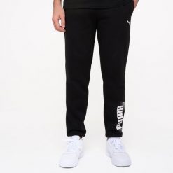 Spodnie dresowe męskie Puma Gym & Pilates. Czarne spodnie sportowe męskie Puma, m, bez wzorów, z bawełny, na fitness i siłownię. Za 169.99 zł.