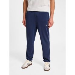 Spodnie do biegania Hummel Pulse. Niebieskie spodnie sportowe męskie Hummel, l, bez wzorów, z dresówki, do biegania. Za 170.00 zł.