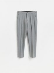 Garniturowe spodnie slim fit - ciemnoszary. Szare garnitury męskie Reserved, l, bez wzorów, z tkaniny. Za 169.99 zł.