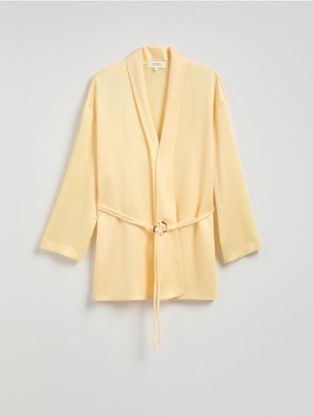 Marynarka z ozdobnym wiązaniem - jasnożółty. Żółte marynarki i żakiety damskie Reserved, bez wzorów, z tkaniny, bez kołnierzyka, bez ramiączek. W wyprzedaży za 119.99 zł.