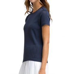 T-shirt Wilson Women's Seamless Pro. Niebieskie t-shirty damskie Wilson, s, bez wzorów, z meshu, bez kołnierzyka, bez ramiączek. Za 293.30 zł.