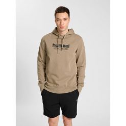 Sweat z kapturem Hummel Booster. Brązowe bluzy męskie Hummel, m, bez wzorów, sportowe, bez ramiączek, z kapturem. W wyprzedaży za 216.50 zł.