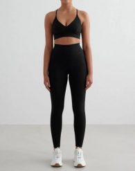 Damskie legginsy wysoki stan, odprowadzające pot, squat proof Sense Tall czarne. Czarne legginsy damskie Aim'n, bez wzorów, z elastanu. Za 301.00 zł.