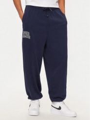 Under Armour Spodnie dresowe UA Icon 1386551 Granatowy Loose Fit. Niebieskie spodnie sportowe męskie Under Armour, m, bez wzorów, z bawełny. Za 219.99 zł.