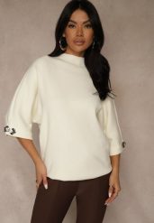 Jasnobeżowy Sweter z Cyrkoniami przy Rękawach Corentusa. Brązowe swetry nierozpinane damskie Renee, m, z aplikacjami, z jeansu, casualowe, bez kołnierzyka, bez ramiączek. Za 79.99 zł.