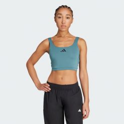 Koszulka Power Light Support Bra. Białe bluzki damskie Adidas, m, bez wzorów, sportowe, bez kołnierzyka, bez ramiączek. Za 199.00 zł.