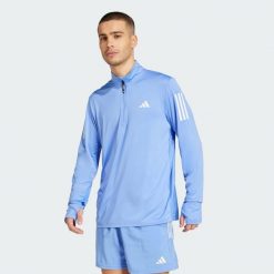 Kurtka Own the Run Half-Zip. Niebieskie kurtki męskie Adidas, xl, bez wzorów, z materiału, sportowe, bez kaptura. W wyprzedaży za 170.82 zł.
