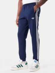 Adidas Spodnie dresowe 3-Stripes KE3561 Granatowy Slim Fit. Niebieskie spodnie sportowe męskie Adidas, m, bez wzorów, z dresówki. Za 259.99 zł.