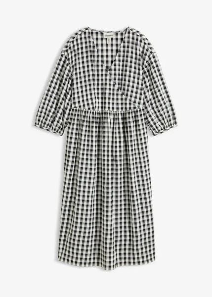 Sukienka midi oversize. Czarne sukienki damskie bonprix, bez wzorów, bez kołnierzyka, bez ramiączek, midi, oversize. Za 99.99 zł.