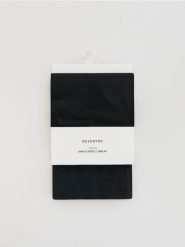 Rajstopy z motywem serca 20 DEN - czarny. Czarne rajstopy i pończochy Reserved, bez wzorów. Za 39.99 zł.