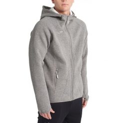 Kurtka Joma Basilea. Czarne kurtki sportowe męskie Joma, xl, bez wzorów, z materiału, z kapturem, trekkingowe. Za 159.99 zł.
