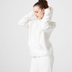 Bluza z kapturem damska Domyos Gym & Pilates 500. Białe bluzy damskie DOMYOS, l, bez wzorów, z bawełny, klasyczne, bez ramiączek, z kapturem. W wyprzedaży za 89.99 zł.