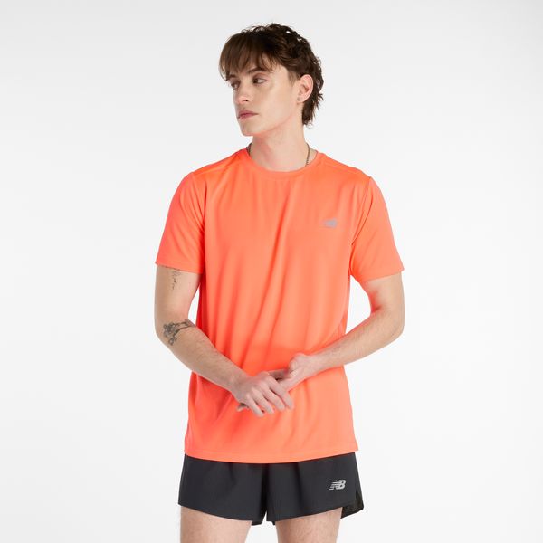Koszulka męska New Balance MT41222URR – pomarańczowa. Brązowe koszulki sportowe męskie New Balance, m, bez wzorów, z materiału, bez ramiączek, na fitness i siłownię. Za 149.99 zł.