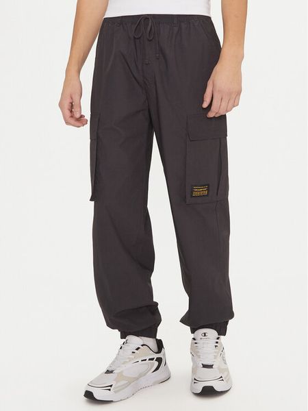 Champion Spodnie dresowe 220415 Czarny Loose Fit. Czarne spodnie sportowe męskie Champion, m, bez wzorów, z bawełny. Za 199.99 zł.