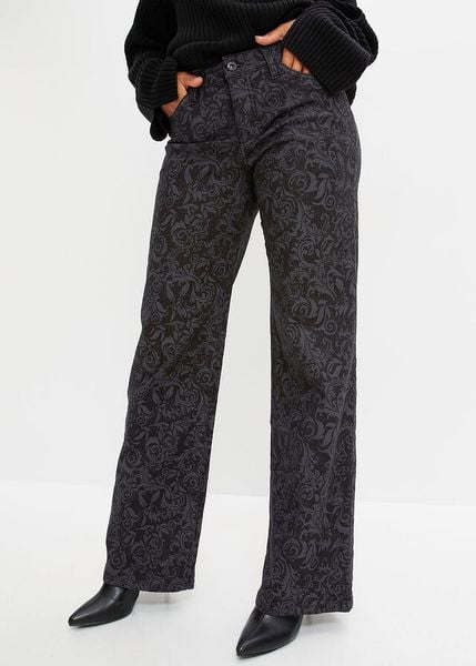 Dżinsy Marlena z połyskującym nadrukiem. Czarne jeansy damskie bonprix, bez wzorów, z jeansu. Za 219.99 zł.
