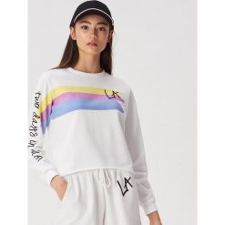 Bluza z motywem La - Kremowy. Białe bluzy damskie Sinsay, m, bez wzorów, bez ramiączek, bez kaptura. W wyprzedaży za 14.99 zł.