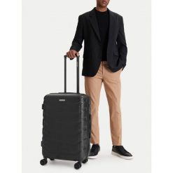 Walizka średnia GINO ROSSI. Czarne walizki damskie Gino Rossi, bez wzorów, średnie. Za 279.99 zł.