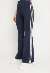 Granatowe Marszczone Legginsy Dzwony z Wysokim Stanem i Lampasami Nakatia. Niebieskie legginsy damskie Born2be, bez wzorów, z jeansu. Za 49.99 zł.
