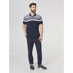 Koszulka polo męska TBS Eltonpol. Niebieskie koszulki sportowe męskie TBS, m, bez wzorów, bez ramiączek, żeglarskie. Za 329.00 zł.