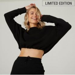 Bluza damska Domyos Gym & Pilates crop. Czarne bluzy damskie DOMYOS, xl, bez wzorów, z bawełny, sportowe, bez ramiączek, bez kaptura. W wyprzedaży za 59.99 zł.