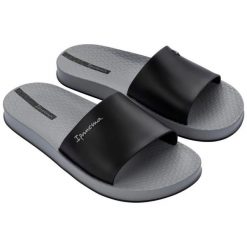 Klapki Ipanema Slide M 82832BC572 czarne. Czarne klapki męskie bez wzorów, z materiału, bez zapięcia. Za 218.61 zł.