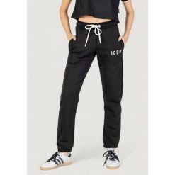Spodnie Kobieta ICON. Czarne spodnie dresowe damskie ICON, bez wzorów, sportowe, długie. W wyprzedaży za 289.35 zł.
